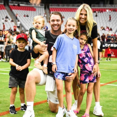 Rachel Glandorf McCoy with her husband Colt McCoy and their four children.